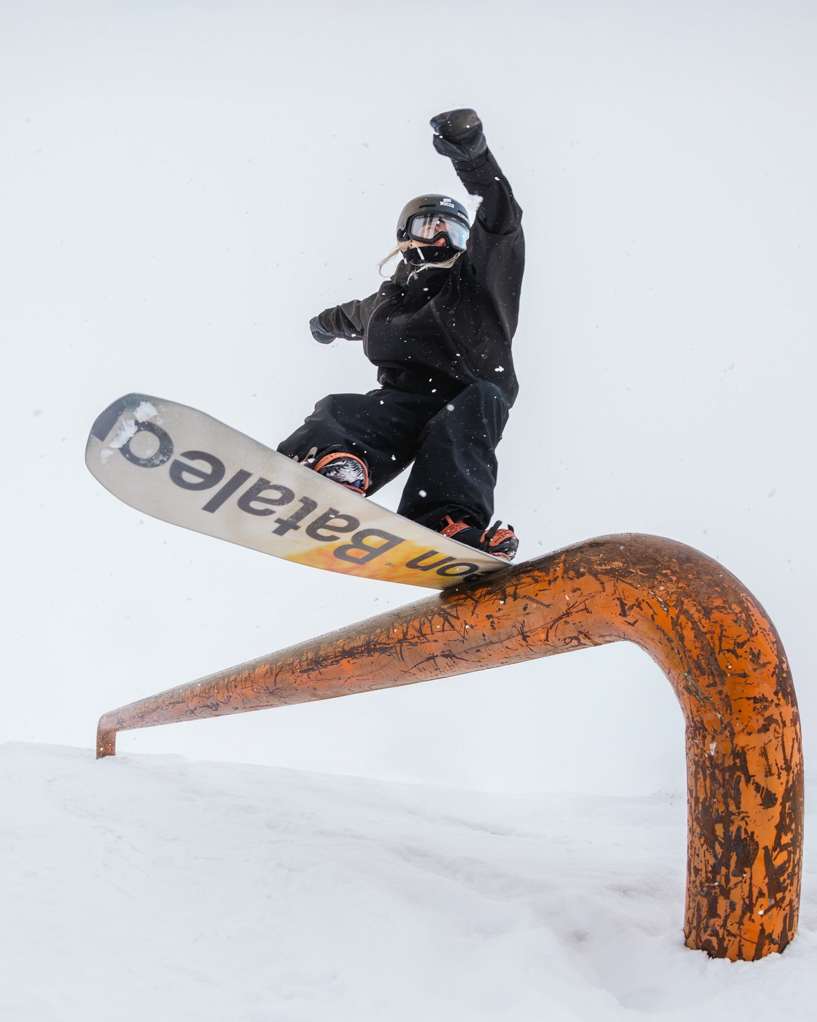 Female Rider grinding over a feature with Bataleon Snowboard Push Up | Bataleon Snowboards 2025/2026